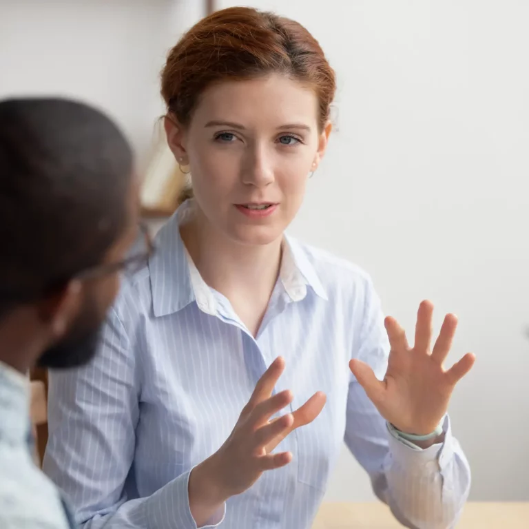 Female affiliate marketing mentor explaining strategy to a male mentee